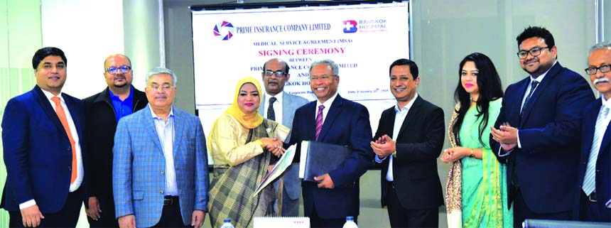 Mohammodi Khanam, CEO of Prime Insurance Company Limited and Dr. Shakti Ranjan Paul, Chairman of Life and Health Limited and Adviser of Bangkok Hospital, exchanging an agreement signing document on Medical Services at Unique Heights in the city recently.