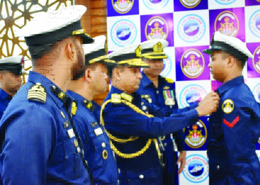 Rear Admiral M Ashraful Haque, Director General of Bangladesh Coastguard, adorning a 'President Coastguard (service) Medal' to Mizanur Rahman, AB (SGQ) on its 24th founding anniversary at the Headquarters of Coastguard in the city on Thursday.