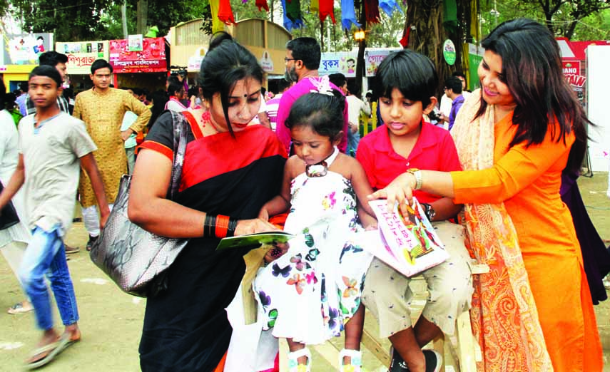 Guardians along with their wards crowded the 'Shishu Prohar' of Bangla Academy Book Fair to buy books of rhymes. The snap was taken from the academy premises in the city on Saturday.