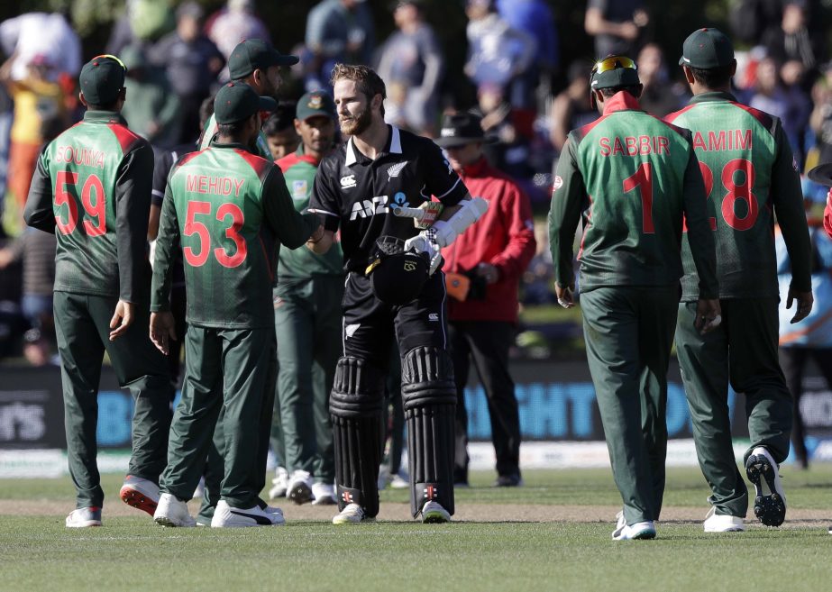 New Zealand captain Kane Williamson (centre) shakes hands with members of the Bangladesh team following their eight wickets victory in their one day international cricket match in Christchurch, New Zealand on Saturday.