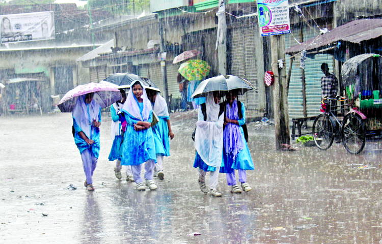 Mostly school going students were found distressed by Sunday's surprise rain in the morning. This photo was taken from Demra area on Sunday.