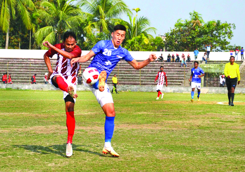 A moment of the football match of the Bangladesh Premier League between Bashundhara Kings and Team BJMC at Shaheed Bhulu Stadium in Noakhali on Tuesday. The match ended in a goalless draw.
