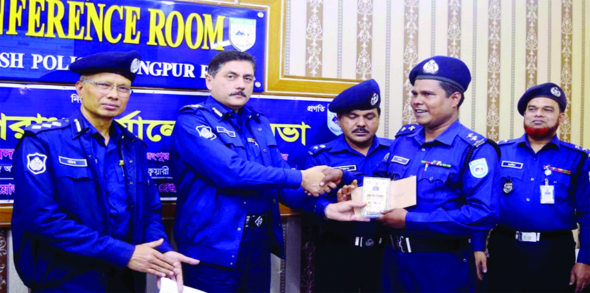 RANGPUR: Devdas Bhatta charya, Deputy inspector General of police Rangpur Range, distributing awards among police personnel and organisations for their excellence in discharging duties at a function on Tuesday.