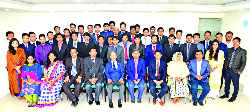 Alauddin A Majid, Chairman, Board of Directors of BASIC Bank Limited, poses for a photograph with the participants of an orientation program on joining of newly recruited Assistant Managers at the Bank's training institute in the city on Wednesday. Senio