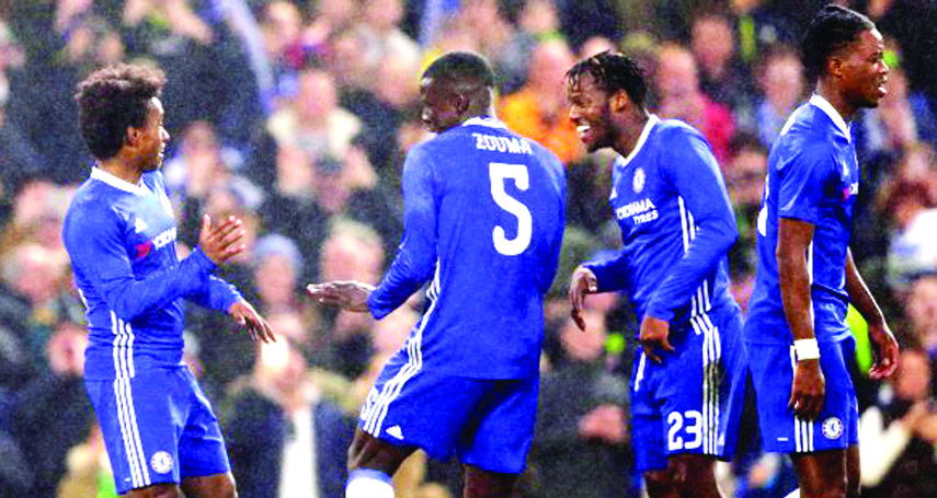 Chelsea's Willian (left) celebrates after scoring his side's third goal during the English FA Cup third round soccer match between Chelsea and Malmo on Thursday.