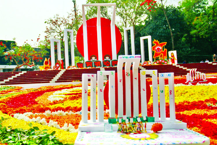 Amar Ekushey Shahid Minar bedecked with flowers.