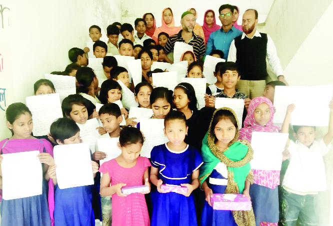 BETAGI (Braguna ): Participants and organisers of a handwriting competition posed for a photo session after the prize distribution programme in observance of the International Mother Language Day jointly organised by Dhrubatara Youth Development Foundat