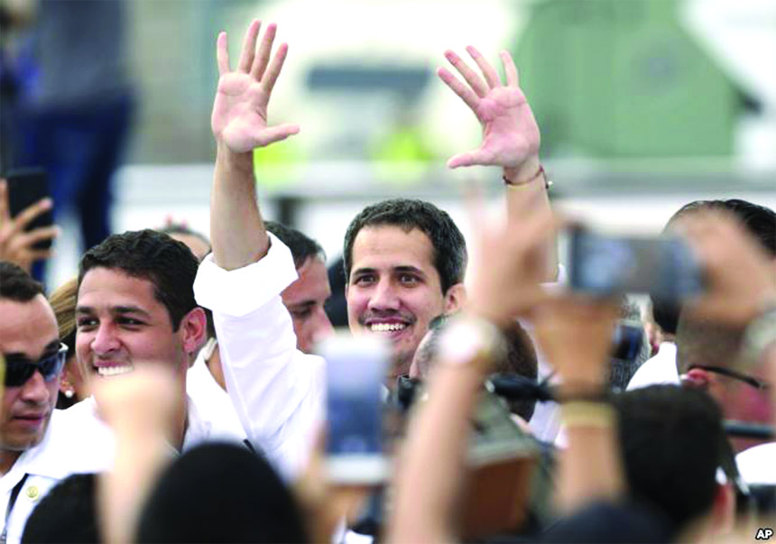 Venezuela's self-proclaimed interim president Juan Guaido (center) arrives at the Venezuela Aid Live concert on the Colombian side of the Tienditas International Bridge near Cucuta, Colombia, on the border with Venezuela, on Friday.