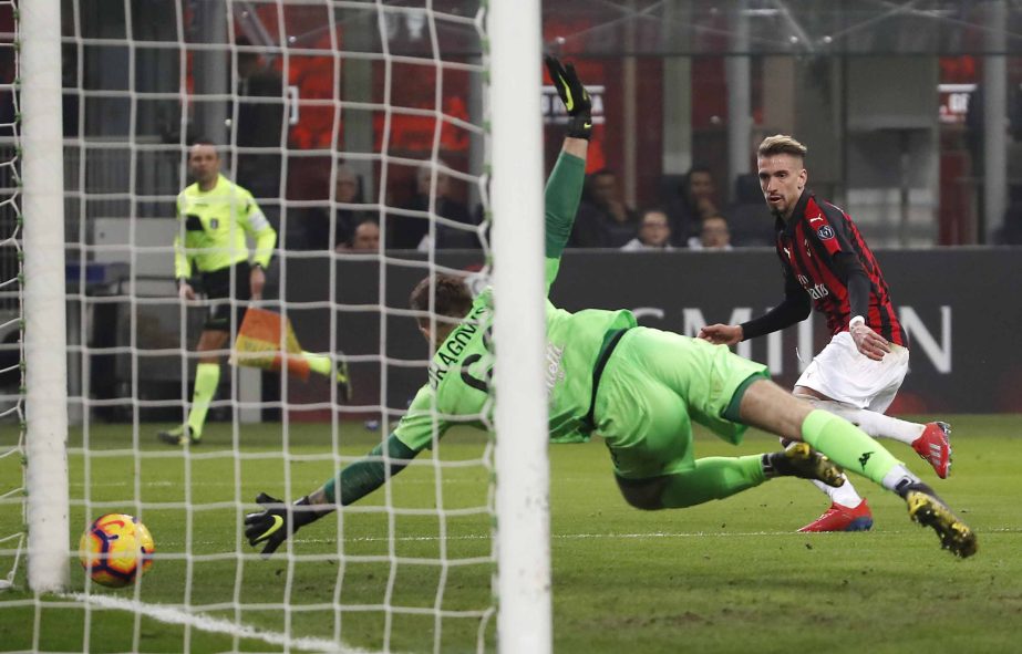 AC Milan's Samuel Castillejo (right) scores his side's third goal during the Serie A soccer match between AC Milan and Empoli at the San Siro stadium in Milan, Italy on Friday.