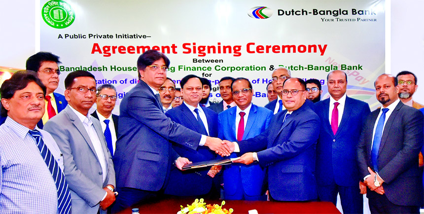 Chanu G. Ghosh, General Manager, Accounts and ICT Division of Bangladesh House Building Finance Corporation and Md. Mosharraf Hossain, Head of Branch Operation and Liability Division of Dutch-Bangla Bank sign an agreement for digitization of loan disburse