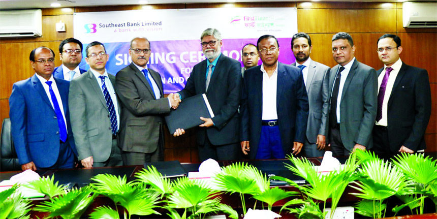 Md. Nazrul Hossain, Managing Director of First Finance and S.M.Mainuddin Chowdhury, Additional Managing Director of Southeast Bank Ltd, inks a deal for for implementation of Collection and Payment Services in the city recently. Mafizuddin Sarker, Executi