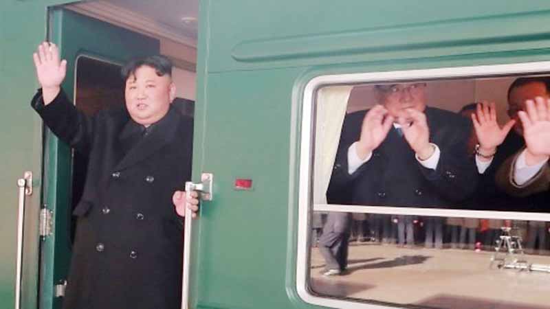 Kim waved to cheering crowds as his train left Pyongyang.