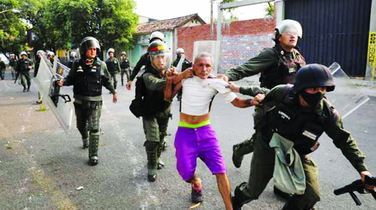 A man is detained during clashes with the Bolivarian National Guard in Urena, Venezuela, near the border with Colombia.