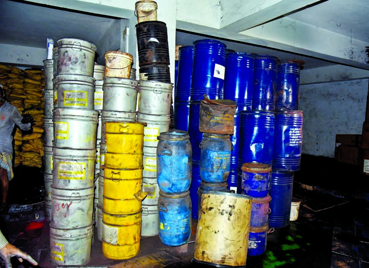 Huge chemical containers stockpiled at the basement of Wahed Mansion at Churihatta in Chawkbazar removed from godown on Sunday.