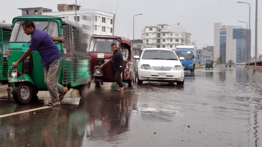 Vehicles movement have been hampered due to Water- logging causes by light rainfall of yesterday moring. This snap was taken from Akhterruzaman Flyover.