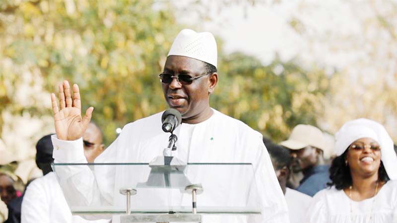 Senegal's President Macky Sall speaks after casting his vote at a polling station in Fatick, Senegal.