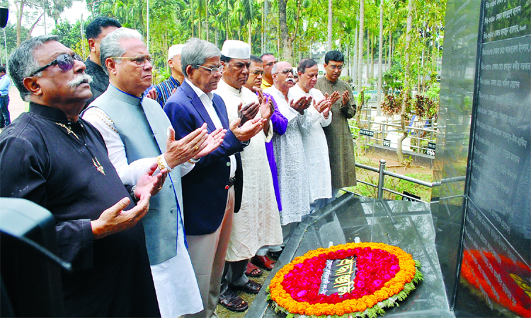 Marking the Pilkhana tragedy day, BNP leaders offering munajat after placing floral wreaths at the grave of victims at Banani graveyard on Monday.