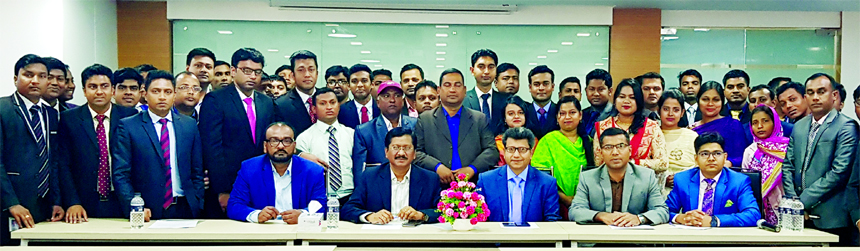 Md Mehmood Husain, Managing Director of NRB Bank Limited, poses with the participants of a daylong training program "Anti-Money Laundering &Foundation Training for Agents and Agent Officials" at the Bank's Training Institute in Dhaka recently. Milton R