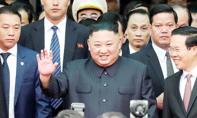 North Korea's leader Kim Jong Un waves as he arrives at the Dong Dang railway station, Vietnam, at the border with China on Tuesday.