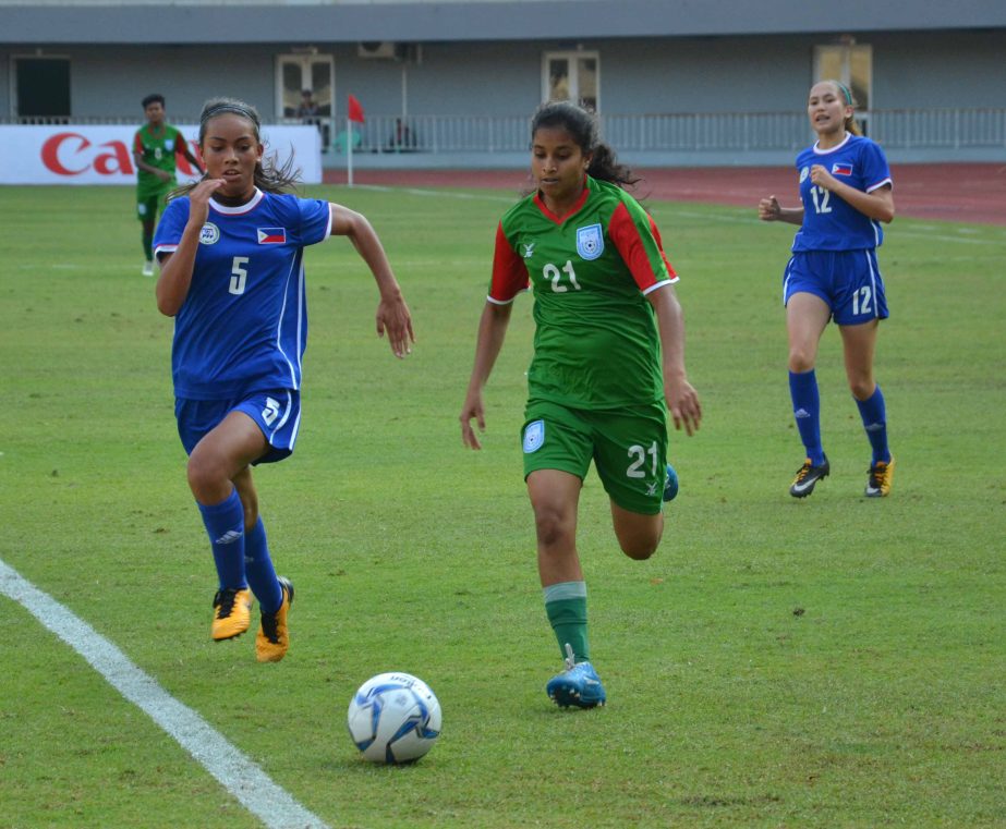 Sultana (right) of Bangladesh Under-16 National Women's Football team advances with the ball during the AFC Under-16 Women's Qualifiers between Bangladesh Under-16 National Women's Football team and Philippines Under-16 National Women's Football team
