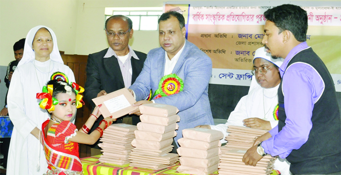 DINAJPUR: Md Mahamudul Hasan , DC, Dinajpur distributing prizes among the winners of annual sports and cultural competition of Saint Franchis Jevier School on Wednesday .