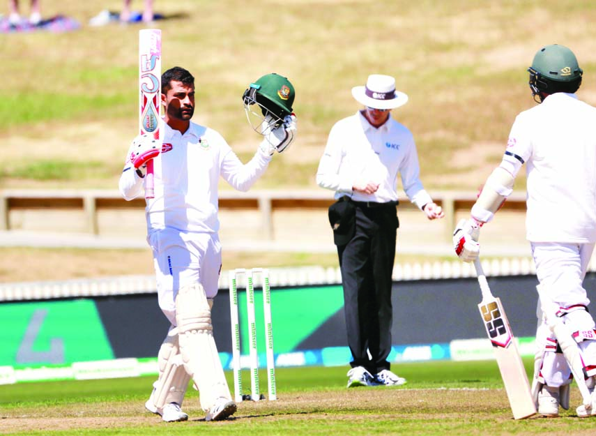 Tamim Iqbal (left) of Bangladesh, celebrating his century during the first day of the first Test match between Bangladesh and New Zealand, at Hamilton in New Zealand on Thursday. BCB photo