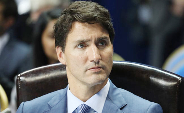 Justin Trudeau has rejected calls to resign and denied claims of political meddling.