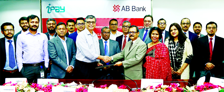 Sajjad Hussain, Managing Director (CC) of AB Bank Limited and Zakaria Swapan, CEO of iPay System Limited, exchanging an agreement signing document at the Banks head office in the city recently. Under the deal, both company will work together to offer thei