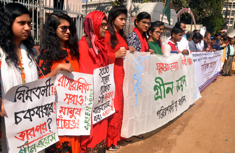 Different environmental orgaisations including Green Voice formed a human chain in front of the National Museum in the city on Friday with a call to ensure planned and safe city.