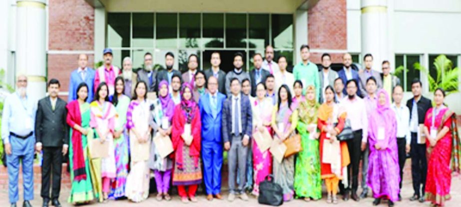 GAZIPUR: Officers of Bangldesgh Open University posed for a photo session after a five day-long training workshop on modern office management at its main campus recently. Photo : BSS