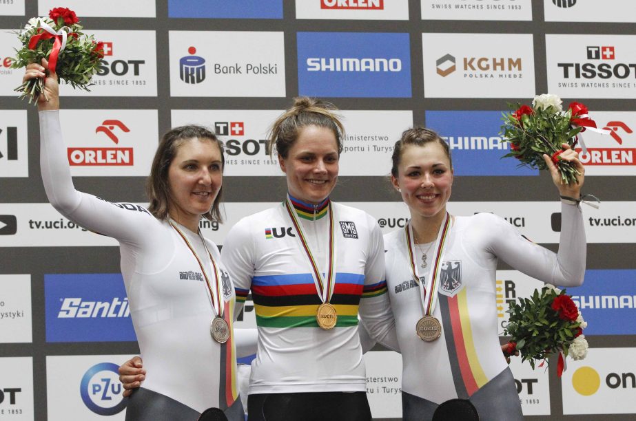 Women's Individual Pursuit silver medalist Germany's Lisa Brennauer (left) gold medalist Australia's Ashlee Ankudinoff (center) and bronze medalist Germany's Lisa Klein pose on the podium at the UCI Track Cycling World Championship in Pruszkow, Poland