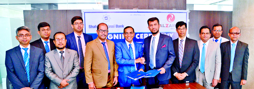M Shahidul Islam, CEO of Shahjalal Islami Bank Limited and Mohammed Anwar Sadath, Managing Director of Al Zaman Exchange W.L.L (Qatar), exchanging an agreement signing document regarding remittance drawing at the Bank's head office in the city on Sunday.