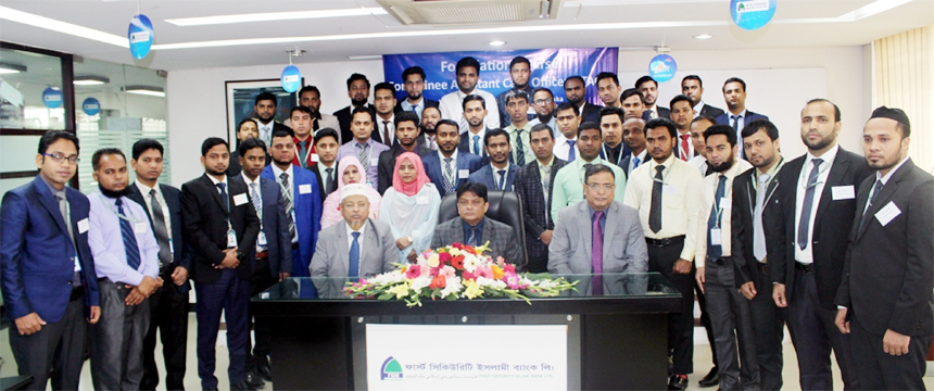 Abdul Aziz, AMD of First Security Islami Bank Limited, poses for a photo session with the participants of its 30th foundation course for its Assistant Cash Officers at the Bank's Training Institute in the city recently. Md. Ataur Rahman, Principal and M