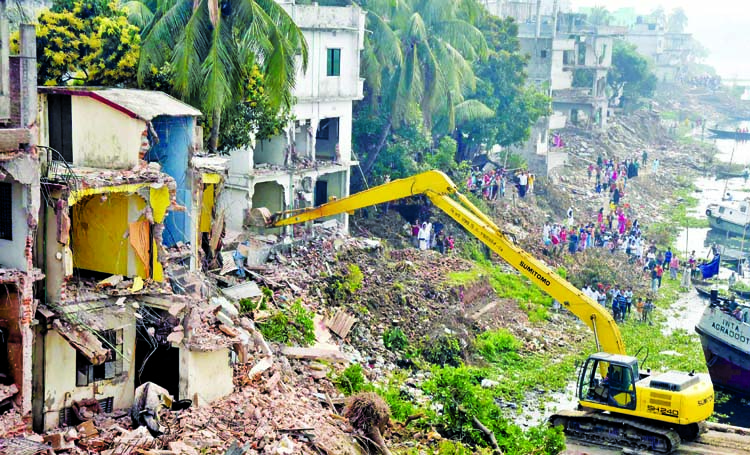 Bangladesh Inland Water Transport Authority (BIWTA) demolishing illegal structures from city's Bashila Cross Dam area on Tuesday