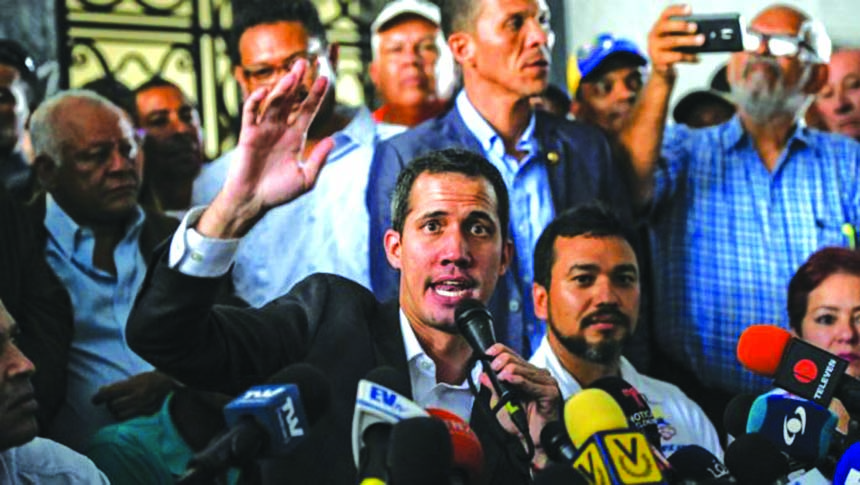 Venezuelan opposition leader and self-proclaimed Acting President Juan Guaido speaks after a meeting with union leaders in Caracas on Tuesday.