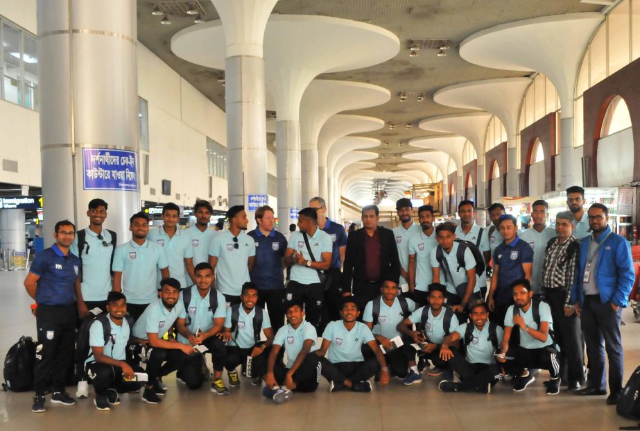 Members of Bangladesh National Football contingent pose for a photo session at the Hazrat Shahjalal International Airport on Wednesday before leaving for Cambodia to play a FIFA International Friendly match against their counterpart Cambodia.