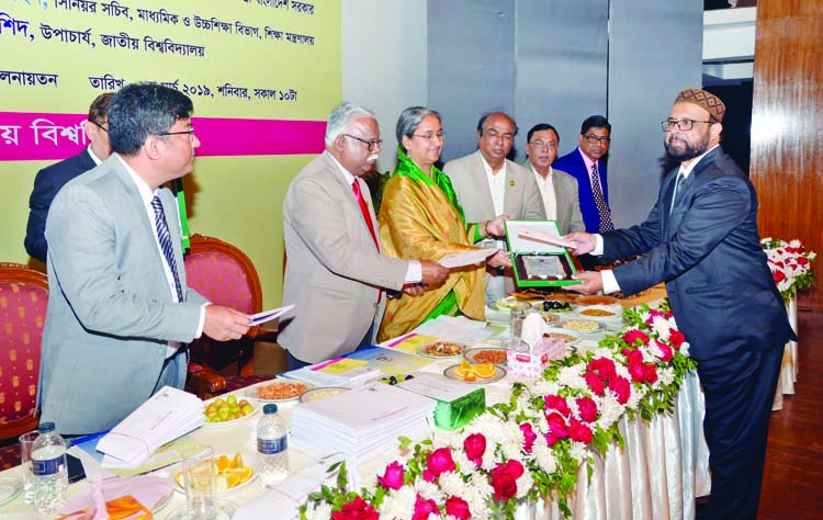 Education Minister Dr. Dipu Moni handing over the 'Best Private College Award 2017' to Prof Shafiqul Islam, Principal (Acting), Dhaka Commerce College at a ceremony held recently in the auditorium of International Mother Language Institute in the city.