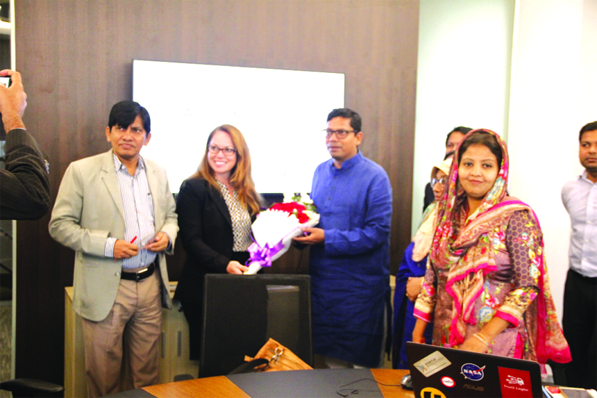 State Minister for ICT Division Zunaid Ahmed Palak, congratulation to Susan Amal, Ph.D, Executive Director of US based Global Entrepreneur Network with bouquet at a discussion meeting held at ICT Tower in city's Agargaon on Thursday. Hesne Ara Begum, Man