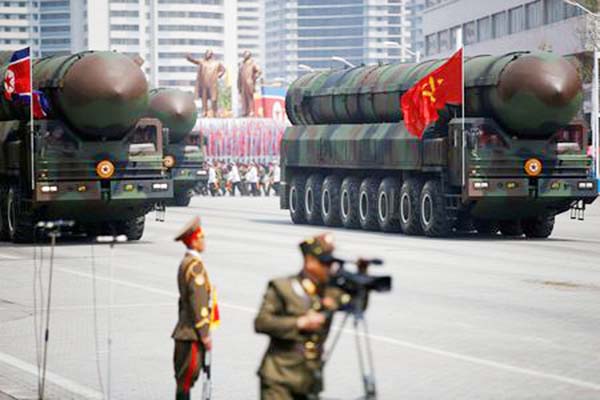 Intercontinental ballistic missiles (ICBM) are driven past the stand with North Korean leader Kim Jong Un and other high-ranking officials during a military parade marking the 105th birth anniversary of the country's founding father Kim Il Sung, in Pyong