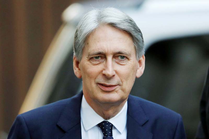 Britain's Chancellor of the Exchequer Philip Hammond is seen outside of Downing Street in London, Britain.