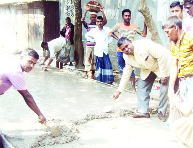 SAGHATA(Gaibandha): Rustom Ali Akhand, Chairman, Saghata Upazila inaugurating carpeting work of a road at Jumurbari Union on Monday.