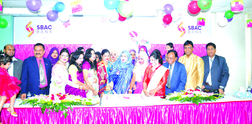 Begum Sufia Amzad, Director of South Bangla Agriculture and Commerce (SBAC) Bank Limited, celebrating the International Women's Day by cutting a cake at its Khulna Branch on Friday. Md. Golam Faruque, Managing Director, Mohammad Nawaz, Director, Dr. Saye