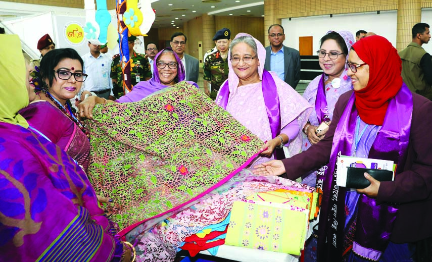 Prime Minister Sheikh Hasina visiting a stall of a fair organised on the occasion of International Women's Day by the Women and Children Affairs Ministry at Bangabandhu International Conference Center in the city on Saturday. BSS photo