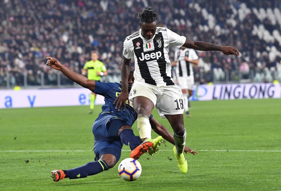Juventus' Moise Kean (right) and Udinese's Ben Wilmot in action during the Italian Serie A soccer match between Juventus FC and Udinese Calcio at the Allianz Stadium in Turin, Italy on Friday.