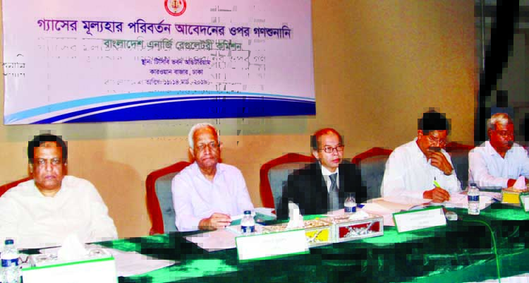 Chairman of Bangladesh Energy Regulatory Commission Monowar Islam, among others, at the mass hearing on appeal of price change of gas at TCB Bhaban in the city on Monday.