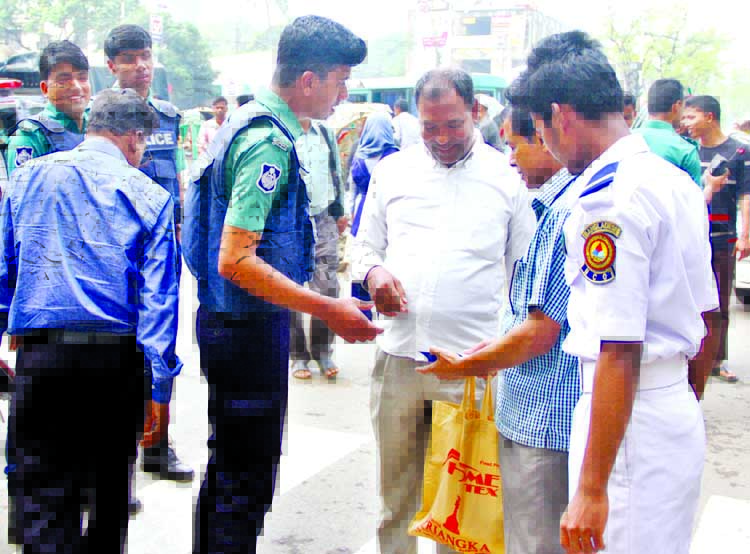 Law enforcers checking students at the entrance of Dhaka University on the occasion of DUCSU election. The snap was taken from Shahbagh area on Monday.