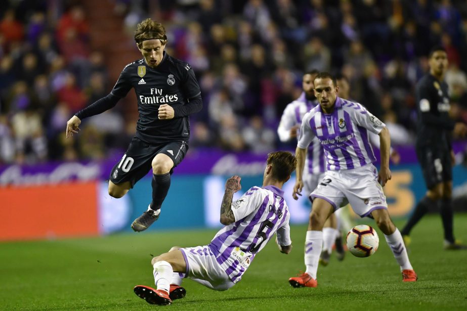 Real Madrid's Luka Modric (left) duels for the ball with Real Valladolid's Luismi Sanchez during the Spanish La Liga soccer match between Real Madrid and Valladolid FC at Jose Zorrila New stadium in Valladolid, northern Spain on Sunday.