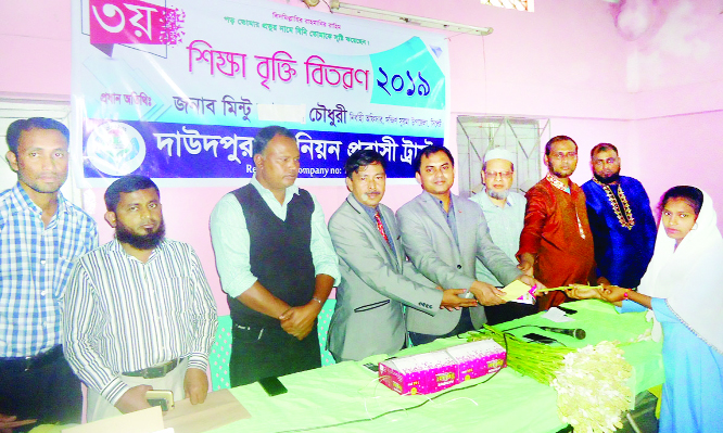 SYLHET: Mintu Chowdhury, UNO, South Surma Upazila distributing scholarship among the meritorious students at Daudpur Union as Chief Guest organised by Daudpur Union Probashi Kalyan Trust recently.