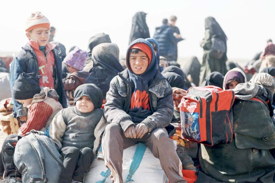 Families fleeing their homes in the village of Baghouz, Syria, for a displaced people's camp . UNICEF estimated that 1,106 children were killed amid the country's civil war in 2018.