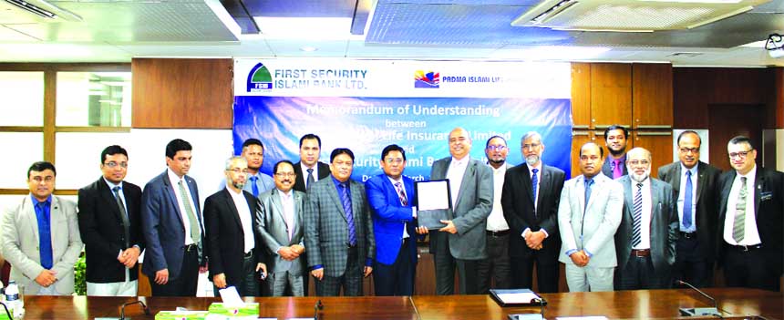 Syed Waseque Md Ali, Managing Director of First Security Islami Bank Limited (FSIBL) and Dr. Chowdhury Mohammad Wasiuddin, Managing Director of Padma Islami Life Insurance Limited, exchanging an agreement signing document regarding life insurance faciliti